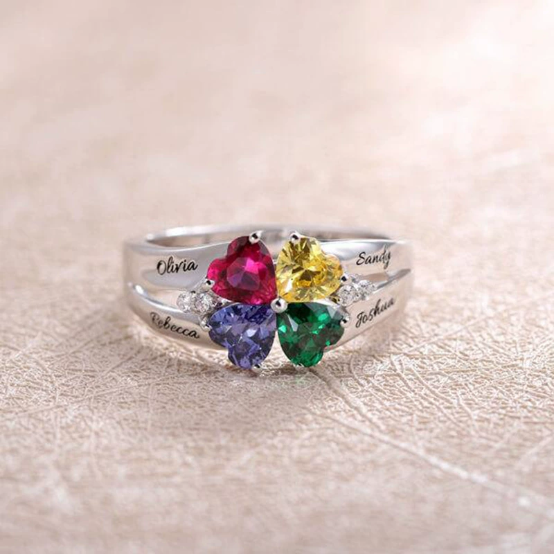Family Constellation Name Ring showing four engraved names around four heart-shaped birthstones