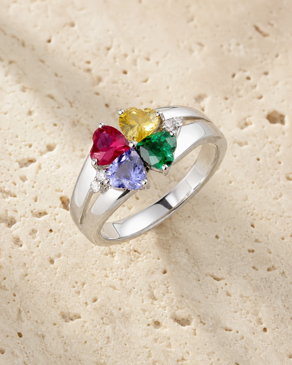 Personalized family birthstone ring on a warm neutral surface