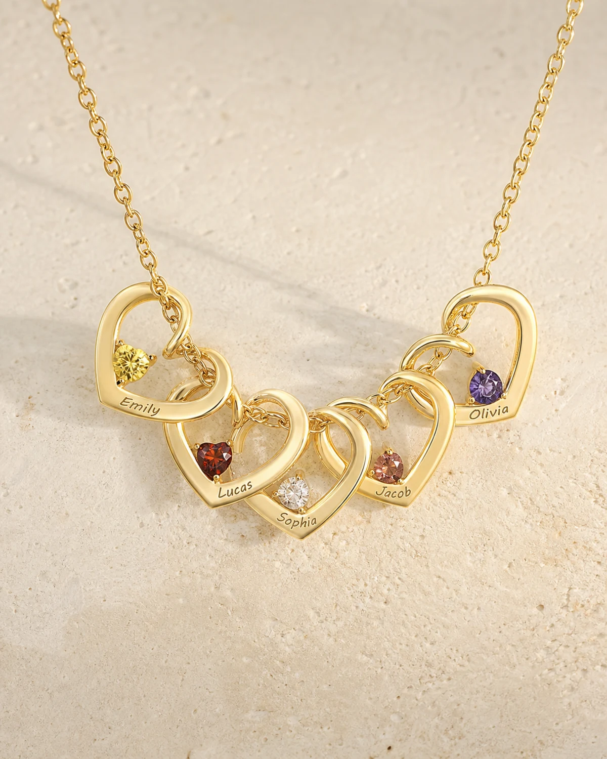 Twisted Heart Birthstone Necklace showing engraved names along each heart and a birthstone inside every heart