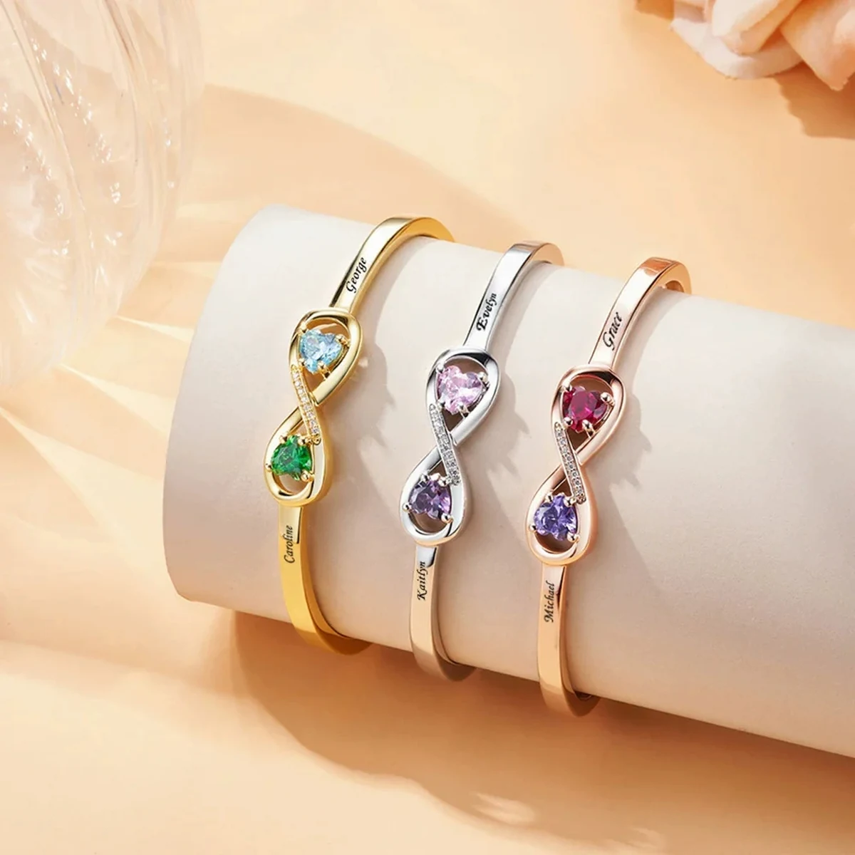 Open Heart Birthstone Cuffs showing the engraved side bands and paired heart-shaped birthstones