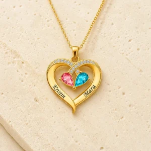 Gold tone Two-Tone Teardrop Story Necklace with two engraved names and two teardrop birthstones