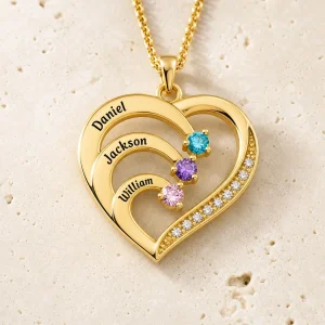 Gold tone family heart necklace with three engraved names and matching birthstones