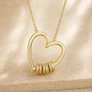 Gold tone open-heart necklace with individually engraved name beads