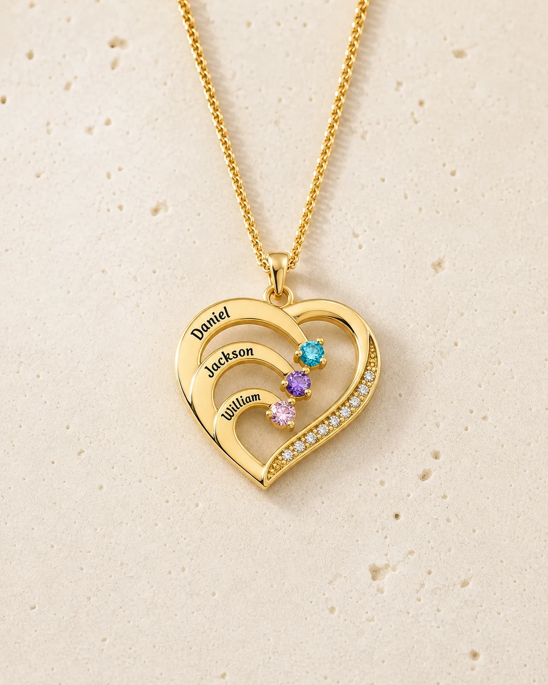 Gold-tone family heart necklace with three engraved names and three birthstones